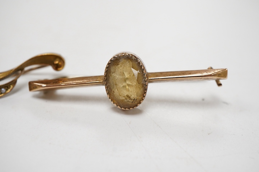 An Edwardian 15ct gold and seed pearl set foliate bar brooch, 41mm, together with a 9ct gold and gem set bar brooch and one other yellow metal and gem set bar brooch.
